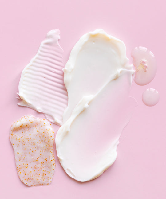 Pink background creams smeared over top