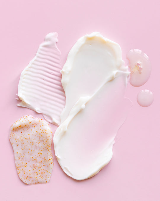 Pink background creams smeared over top