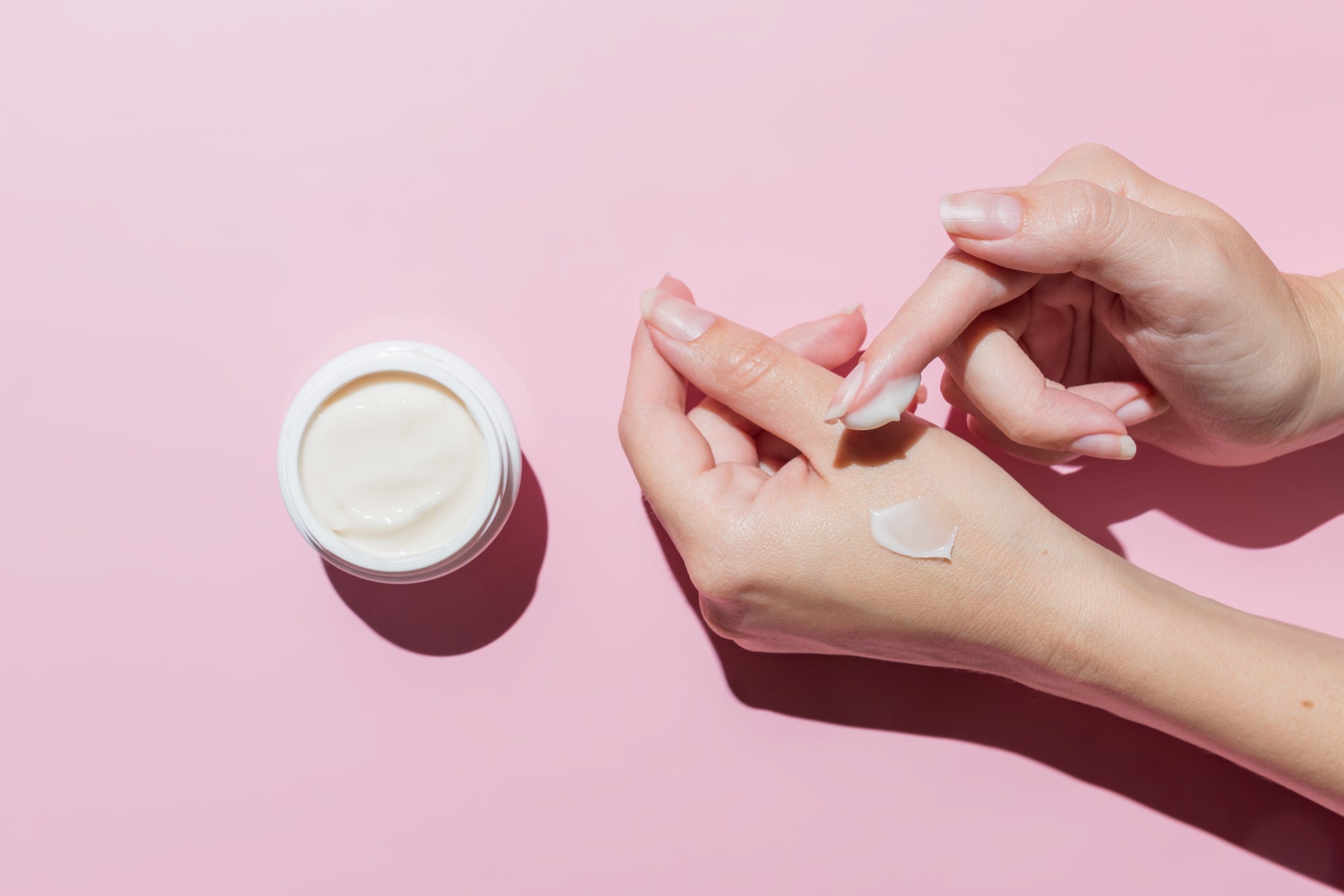 Private Label Skin Care - Applying Hand Cream on Hand